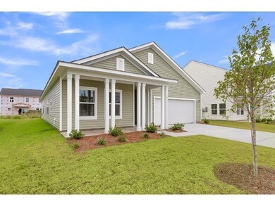 View of front facade with a garage and a front yar