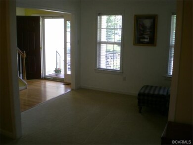 Hardwood flooring in Foyer with side light windows