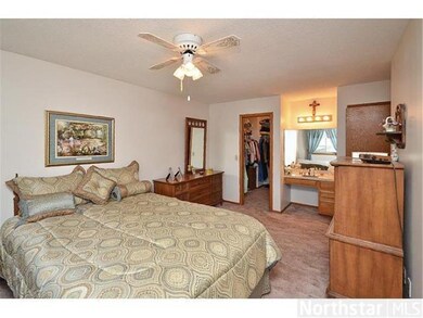 Large master suite features a walk in closet, ceil