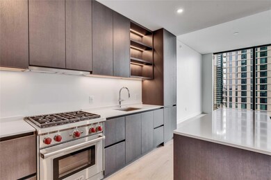Kitchen with open shelves, premium stove, modern cabinets, light wood-style flooring, and recessed lighting