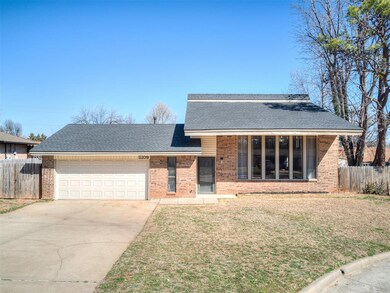 View of front of home with brick siding, concrete 