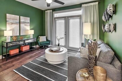 Living area with hardwood / wood-style flooring an