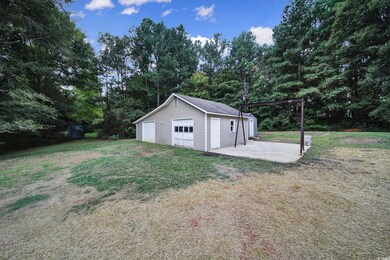 Exterior space with an outbuilding and a garage