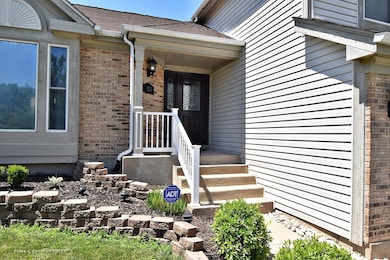 Welcoming Covered Front Porch with Beautiful Brick