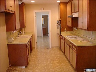 Kitchen with Door to Laundry Room and 1/2Bath