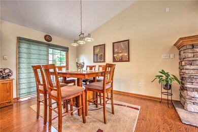 The adjoining dining area has matching lighting an