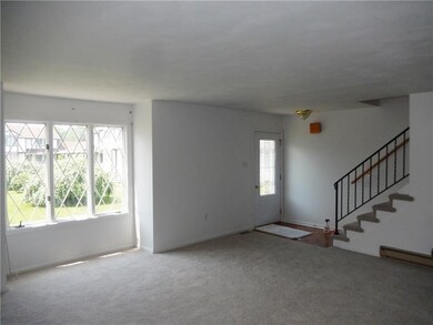 Spacious living room complimented by the large win