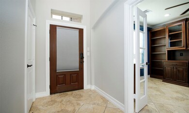 Upon entry the study is on the right through the French doors.