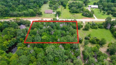 Aerial view of property's location with a heavily