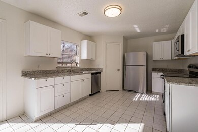 Kitchen with sink, stainless steel appliances, and