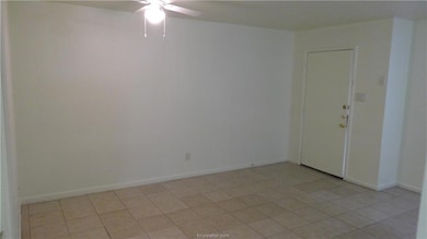 Spare room featuring light tile patterned floors,