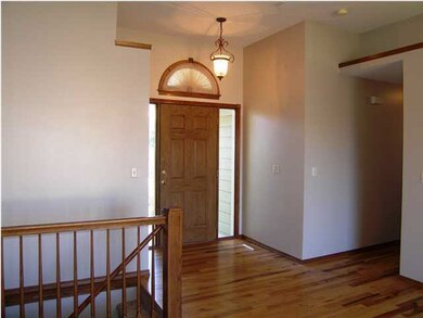 The entry foyer has hickory flooring which flows i