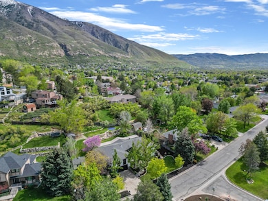 Aerial overview of property's location with mountains and nearby suburban area