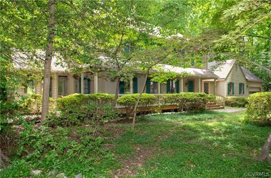 Rear view of property with a lawn