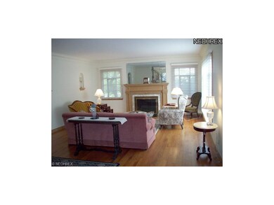 The hardwood floors flow into the living room with
