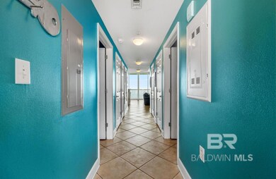 Hallway with light tile patterned flooring