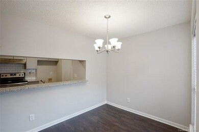 DINING ROOM: The sunlit dining room features a gra