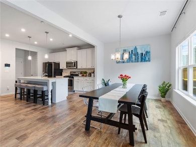 Dining room featuring recessed lighting, wood fini