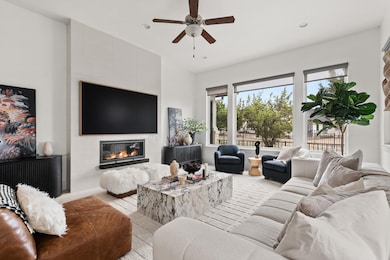 Living room with recessed lighting, a ceiling fan