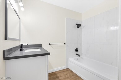 Full bathroom featuring  shower combination, wood