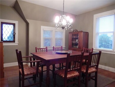 Hardwood floor, bronze chandelier and original lea