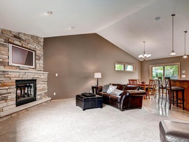 Vaulted ceilings, beautiful fireplace and open con