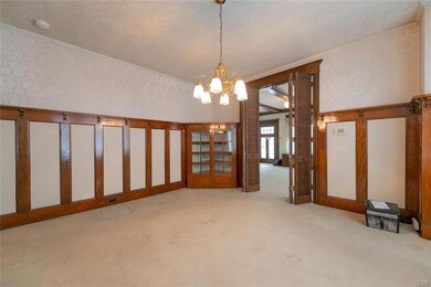 Dining room with custom woodwork and china cabinet