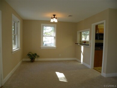 Dining Room with New Light Fixture, Carpet and Paint