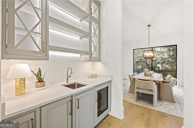 Wet bar complete with a built-in Sub-Zero beverage refrigerator and ice maker.