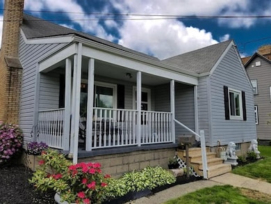 The beautiful landscaping and large porch are very