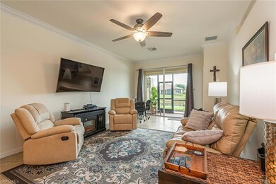 LIVING ROOM WITH A VIEW TO THE SCREENED LANAI AND 