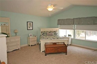 The spacious master bedroom has vaulted ceilings a