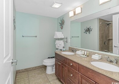 Full bathroom with tile patterned floors, double s