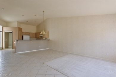 Unfurnished living room with a chandelier, light t