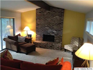 Wall of windows opens the living room to the backy