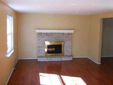 Living Room. Brick fireplace.