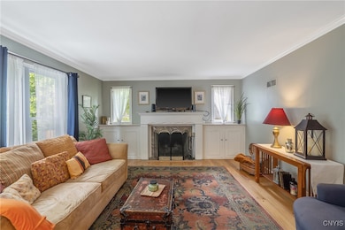 The marble-faced fireplace with traditional mantle