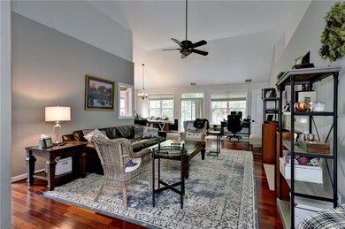 Enter into the great room. High ceilings and beautiful hardwood floors.