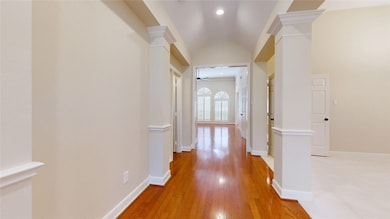 Long open foyer with view of plantation shutters i