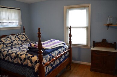 Spacious Second Bedroom with Hardwood Flooring