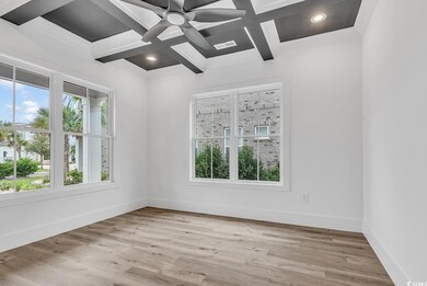 Empty room with plenty of natural light, coffered 