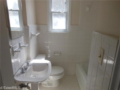 Bath. All tile bathroom with sunny window