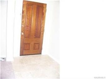Beautiful front door and travertine marble foyer