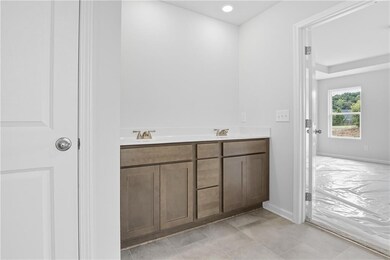 Bathroom featuring double vanity and recessed lighting