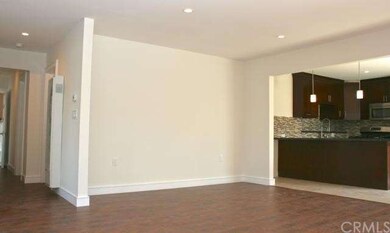 Dining space open to the kitchen offers a contempo