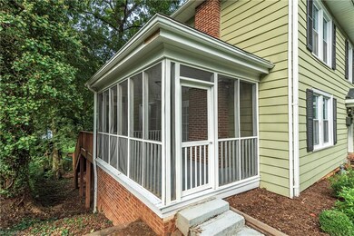 Darling screened porch could be glassed in to make a sun room for year round  use.