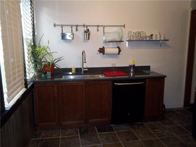 Kitchen with dishwasher and gas stove.