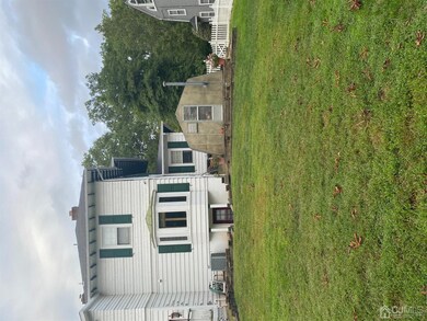 backyard view of greenhouse