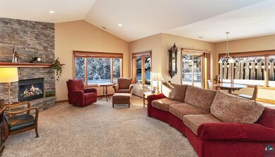 features a custom stone gas fireplace