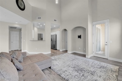 Living room with high vaulted ceiling